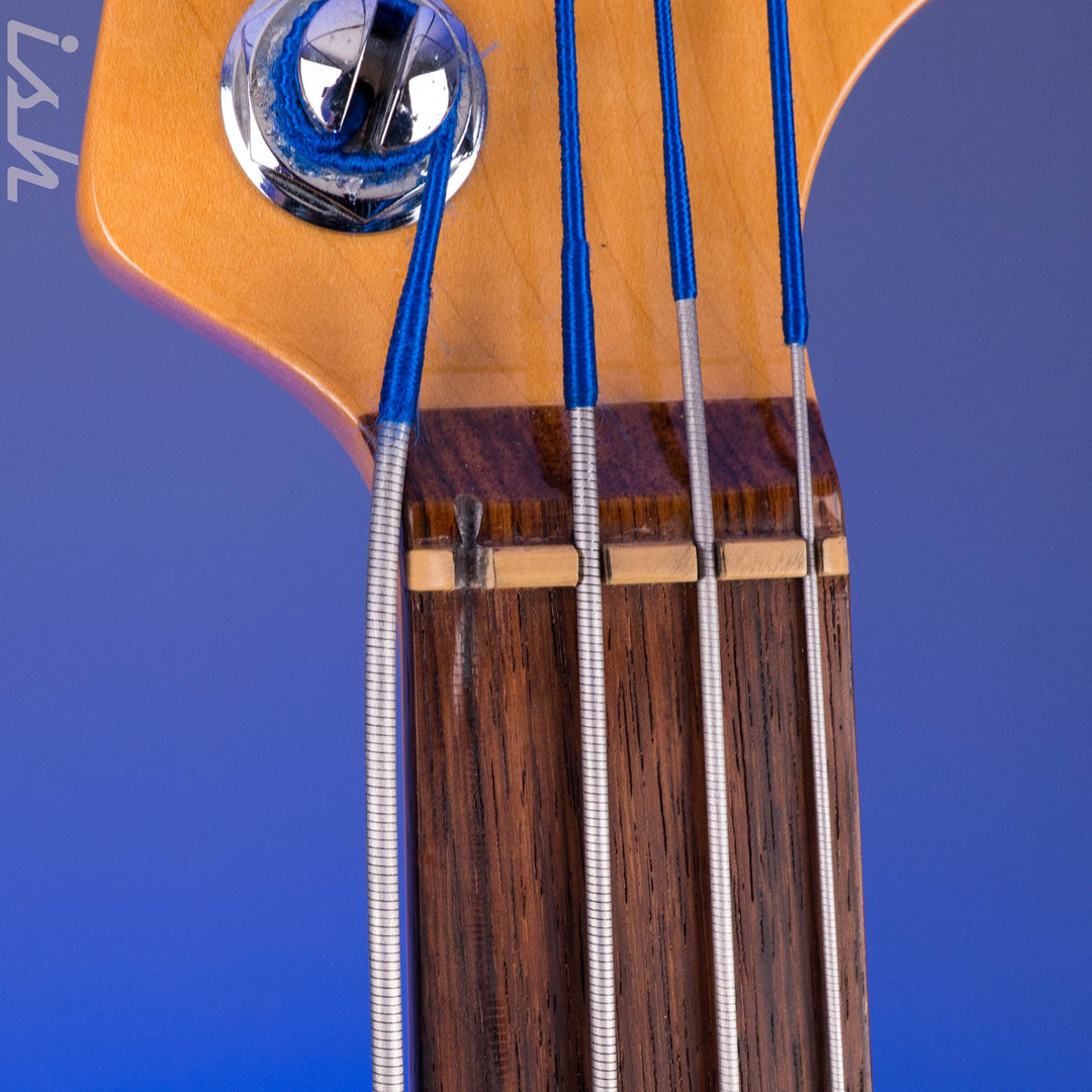 1999 Fender American Deluxe Jazz Bass Fretless 4-String Transparent Crimson Red